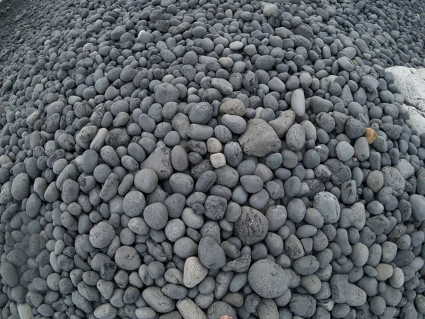 Volcanic stones of Mavra Volia Beach at Chios island Greece. — Stock Photo, Image