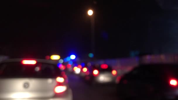 Defocused Ambulance Stucked Traffic Jam Night Cars Moving — Stock Video