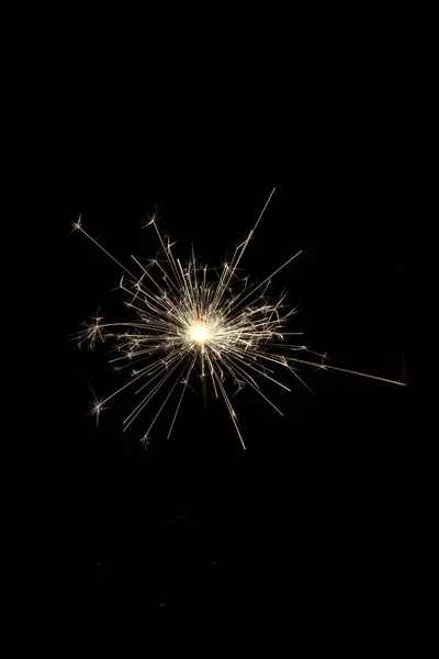 Burning squib on a black background with sparks. — Stock Photo, Image