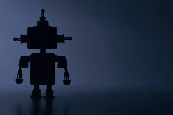 Silhouette d'un robot mignon sur fond bleu . — Photo