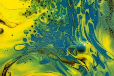 Mavi, yeşil ve sarı soyut boya arka planı.