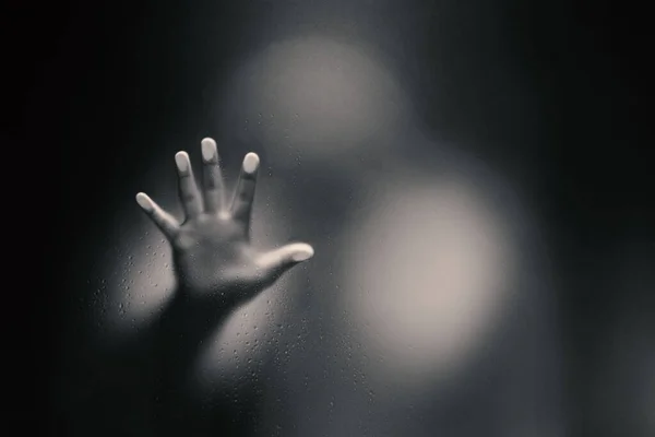 Black color version of Creepy man holding the frosted glass with — Stock Photo, Image