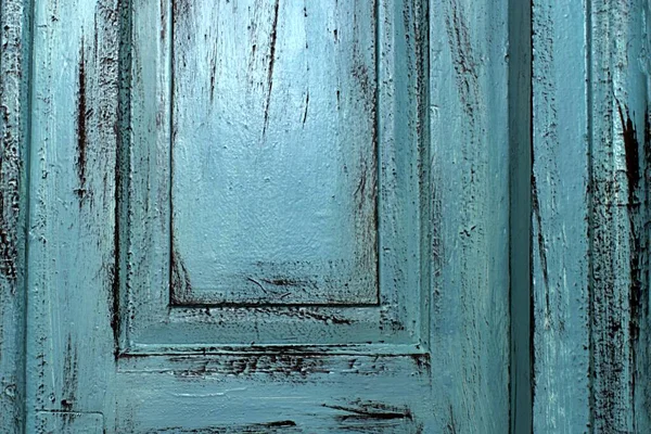 texture of a painted wooden door with a bright area with reflections in the upper part