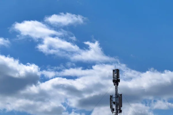 telecommunication equipment antennas on blue sky background
