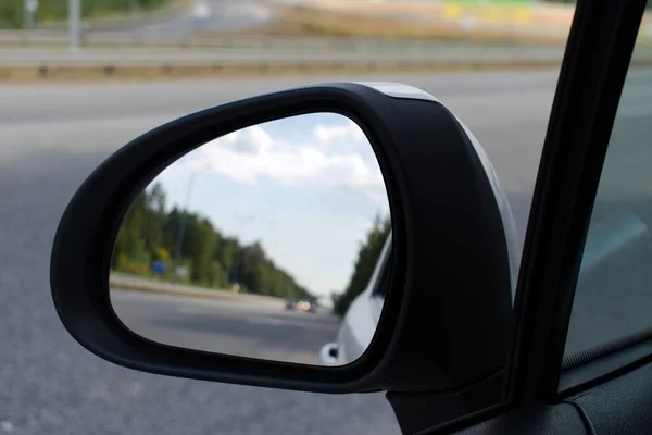 car rear view mirror with blurred image on blurred background inside view