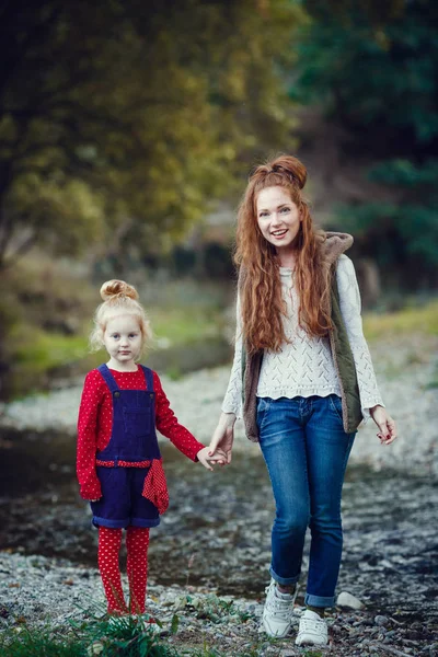 A series about happy red-haired. The elder sister and younger brother and sister. Park, autumn, river