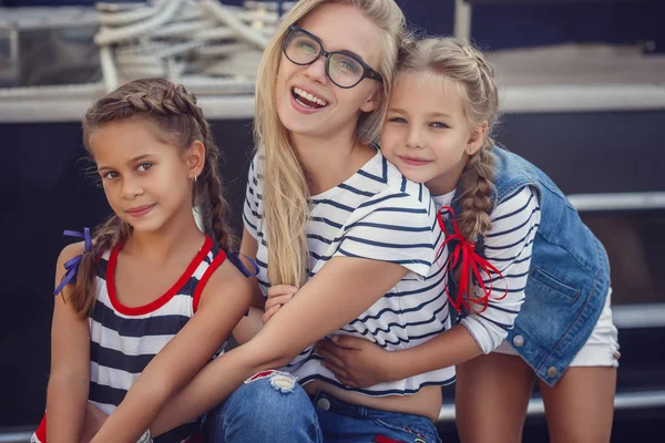 The elder sister and younger sisters and a brother in a marine s — Stock Image The elder sister and younger sisters and a brother in a marine s Stock Image