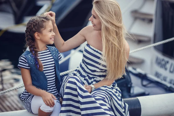 The elder sister and younger sisters and a brother in a marine s — Stock Image The elder sister and younger sisters and a brother in a marine s Royalty Free Stock Images