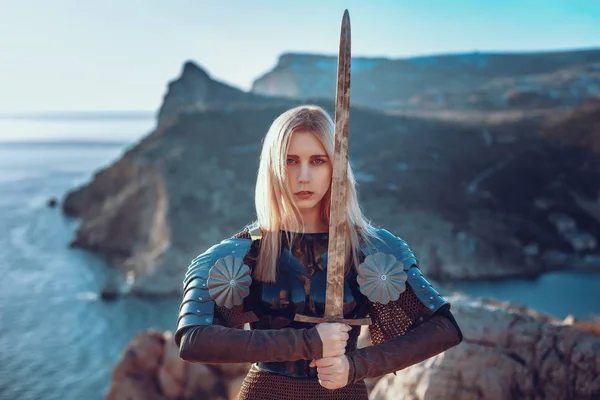 The cute female warrior attacking with sword — Stock Photo, Image