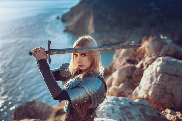 The cute female warrior attacking with sword — Stock Photo, Image