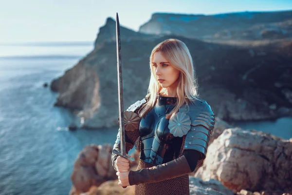 The cute female warrior attacking with sword — Stock Photo, Image