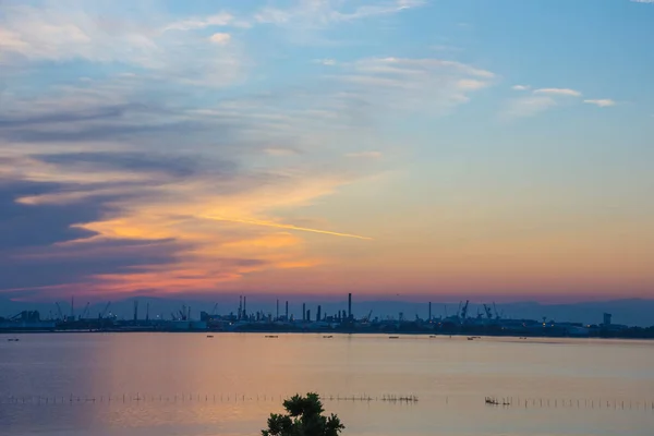 View of the industrial area and shipping port in Venice, Italy, at sunset