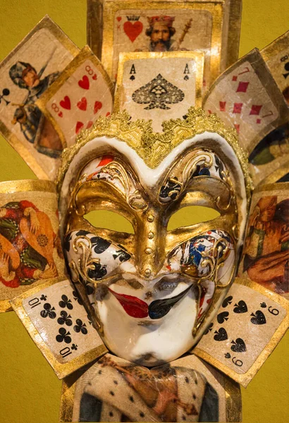 Traditional Venetian mask on the streets of Venice, Italy, isolated on colorful background.