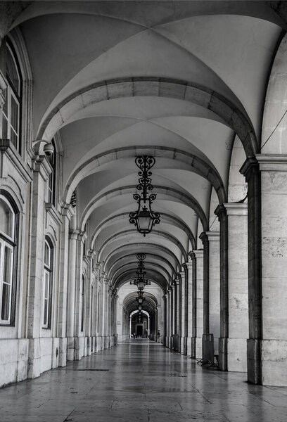 The arcades in Commerce square (Praca do Comercio), in Lisbon, Portugal