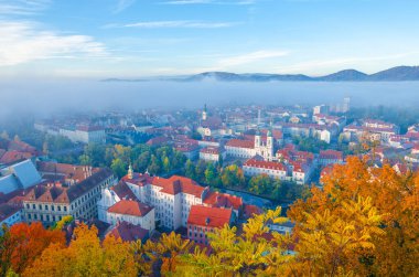 Cityscape of Graz with Mur river and Mariahilfer church (Mariahilferkirche), view from the Shlossberg hill, in Graz, Styria region, Austria
