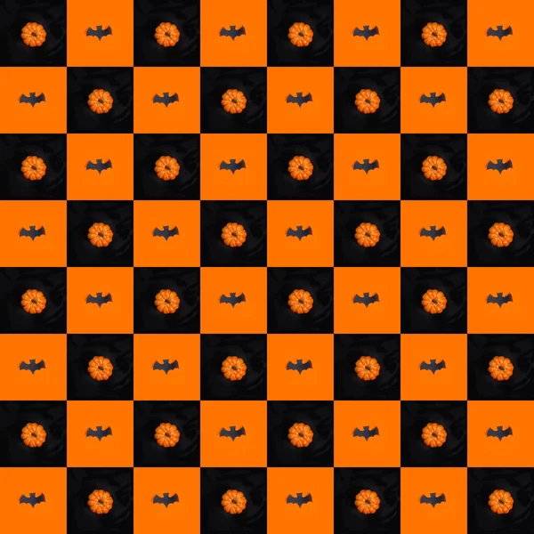 万圣节快乐 黑色背景的橙色和南瓜上的黑色蝙蝠无缝模式 — 图库照片