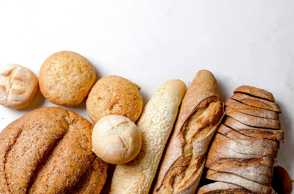 Assortment of baked goods on white background