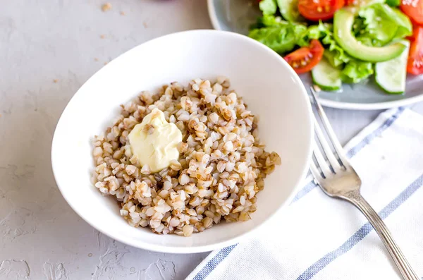 Buckwheat porridge in white plate for lanch — Stock Photo, Image