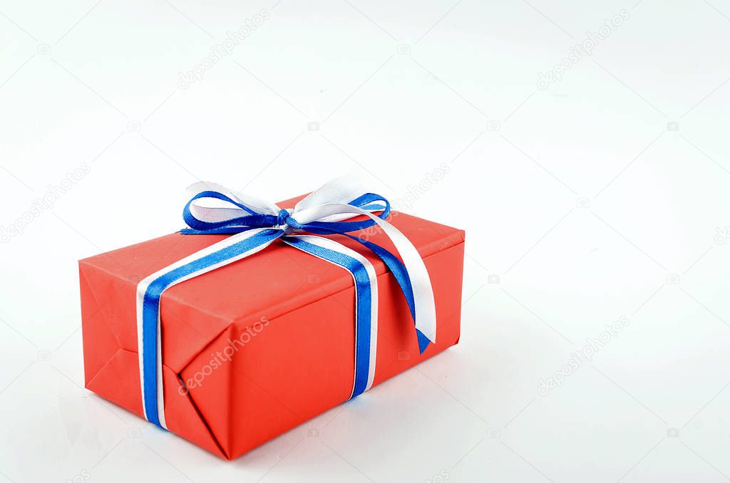 red, blue and white gift boxes with ribbons on a white backgroun
