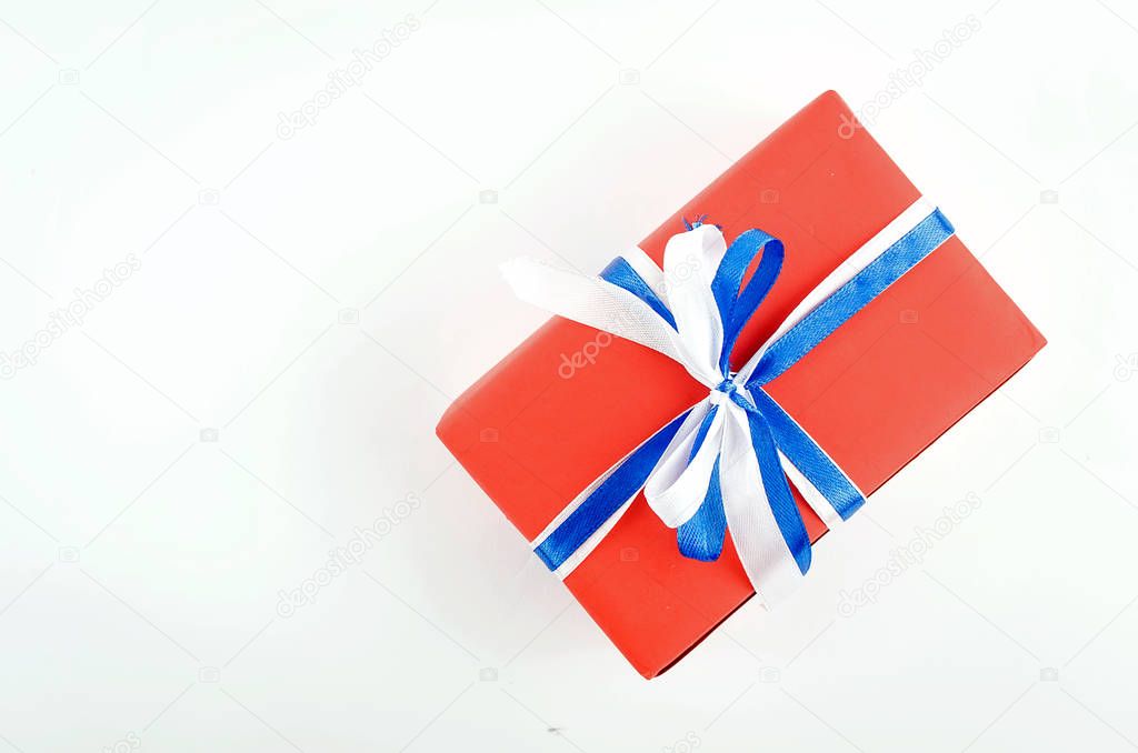 red, blue and white gift boxes with ribbons on a white backgroun