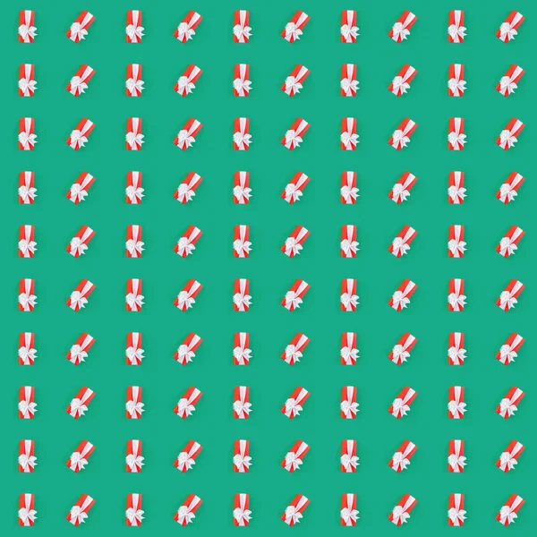 Seamless pattern with red gift box over the green background