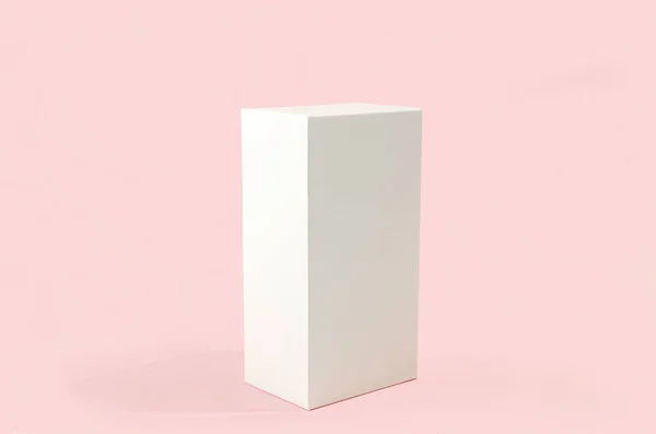 White geometric figure, a rectangular with shadows on a light pink background. Abstract minimal scene with empty place for a signature, mock-up