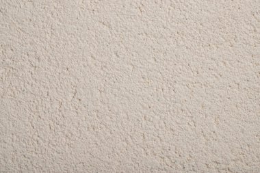 Evin duvarında bej desenli alçı, arka plan.