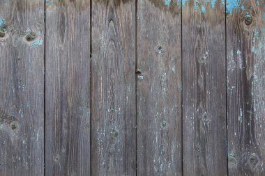 Tahtalardan yapılmış eski ahşap çitler. Boya ve çizikler, arka plan, grunge.