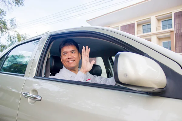 Businessman waves hand as a sign of greeting. — Stock Photo, Image