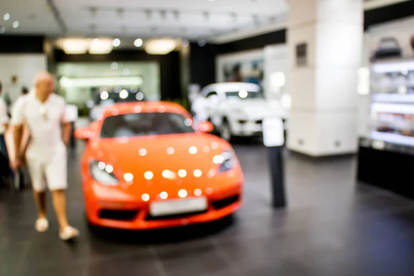 Visitor at motor show in shopping mall — Stock Photo, Image