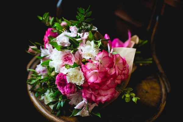 Chic bouquet of natural flowers in an elegant chair
