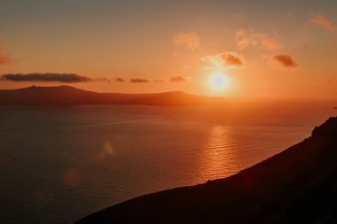 Oia Santorini Greece famous with romantic and beautiful sunsets. Oia village in Santorini island.Greece. clipart