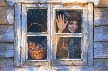 witch is quite mad, she looks out the window and laughing staring eyes, may be she did the nasty, and can just be happy today clipart