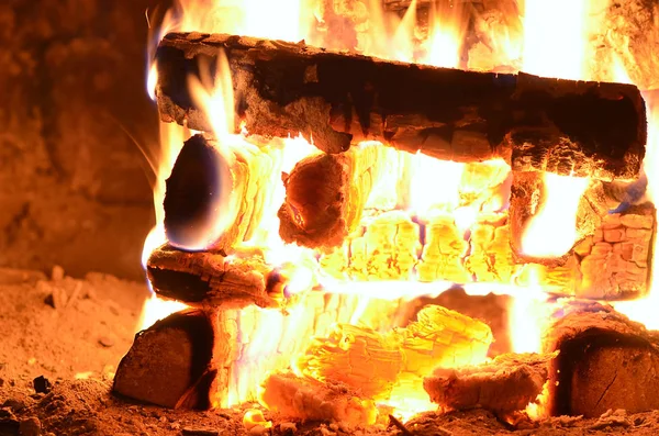 hot flaming wood in the hearth close-up-background image