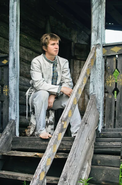 Young Man Old Linen Clothes Sitting Wooden Porch Village Hut Royalty Free Stock Photos