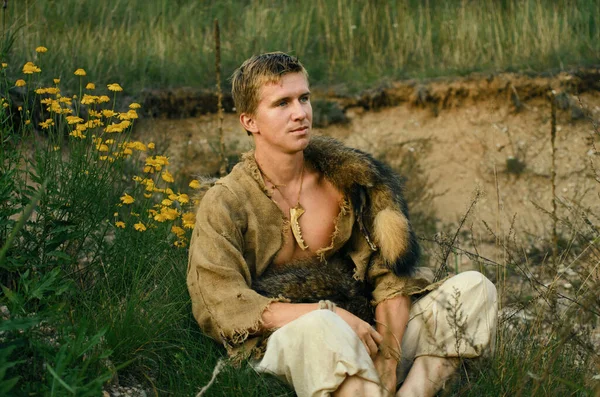 Young Medieval Hunter Rests Slope Hill Covered Flowers Herbs — Stock Photo, Image