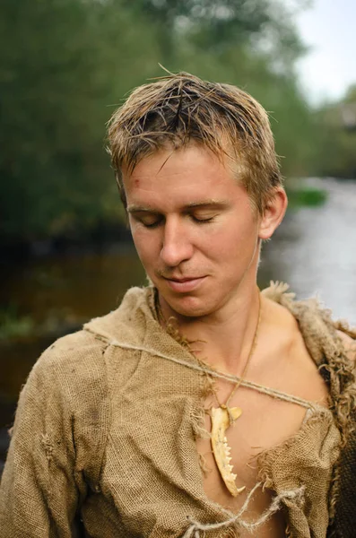 Young Medieval Man Sacking Clothes — Stock Photo, Image