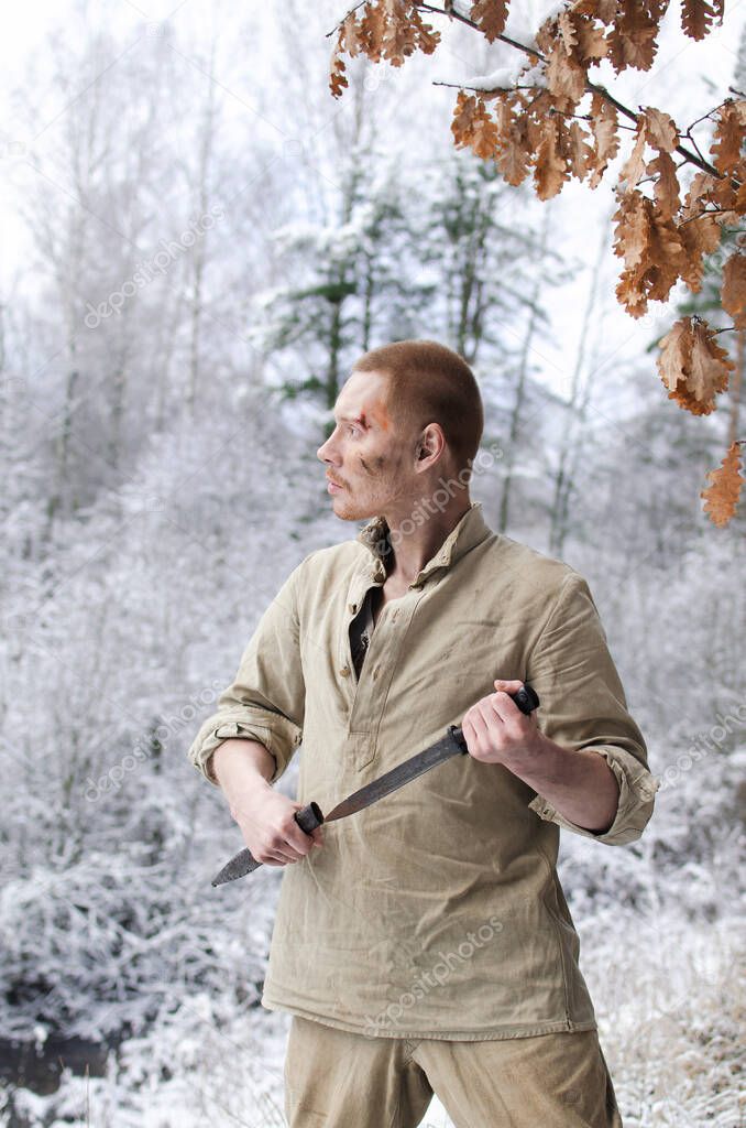 soldier in the uniform of the second world war noyna in the winter forest