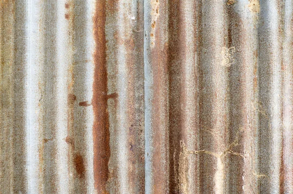 Closed-up of rusty galvanized iron steel plates wall for abstract texture background. Rusty corrugated metal texture surface or galvanize steel background.