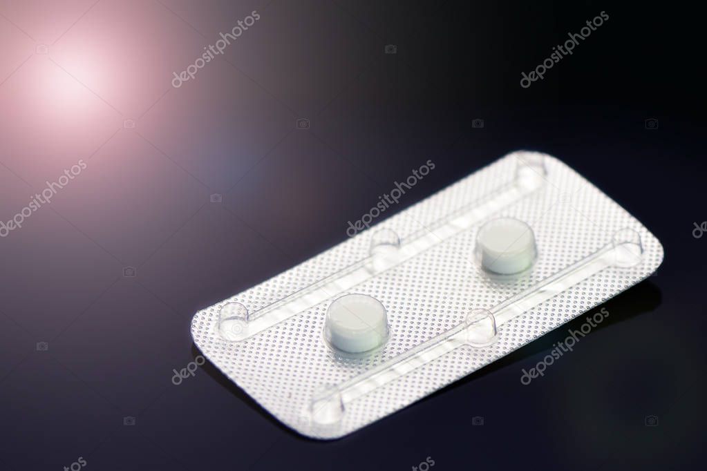Emergency Contraceptive Pills, Morning-After Pills or Post-coital Pills on Dark Background.