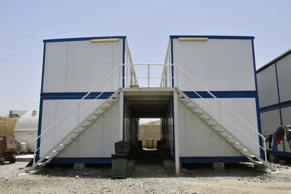 Portacabin. Taşınabilir ev ve ofis kulübeleri. Çalışma Kampı. İskele kulübesi. küçük geçici evler
