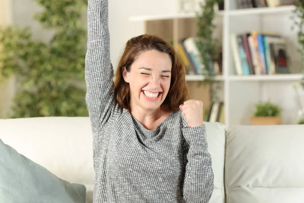 Excited Girl Celebrates Good News Sitting Couch Living Room Home — Stock Photo, Image