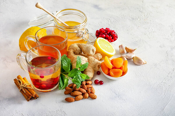 Various healthy natural products for immunity boosting and cold remedies on white background.