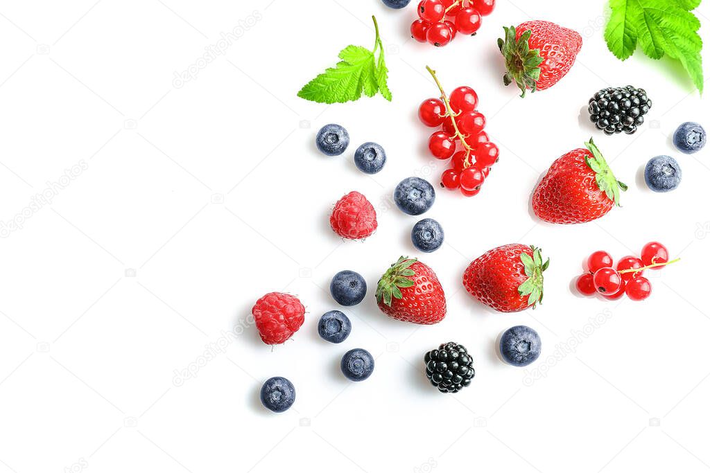 Assorted wild fresh berries isolated on white background. Top view. Copy space.
