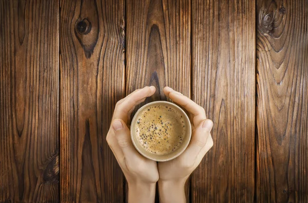 Hands Holding Cup Hot Black Coffee Wooden Background Top View — Stock Photo, Image