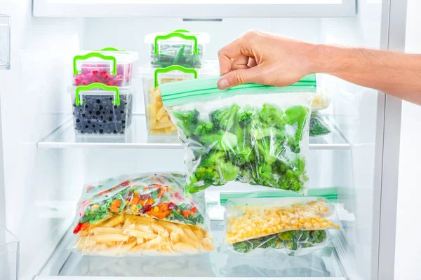 Hand Choosing Package Frozen Broccoli Freezer — Stock Photo, Image