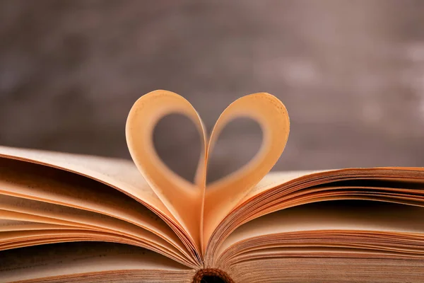 Book Pages Folded Shape Heart Wooden Desk Black Chalkboard Background — Stock Photo, Image
