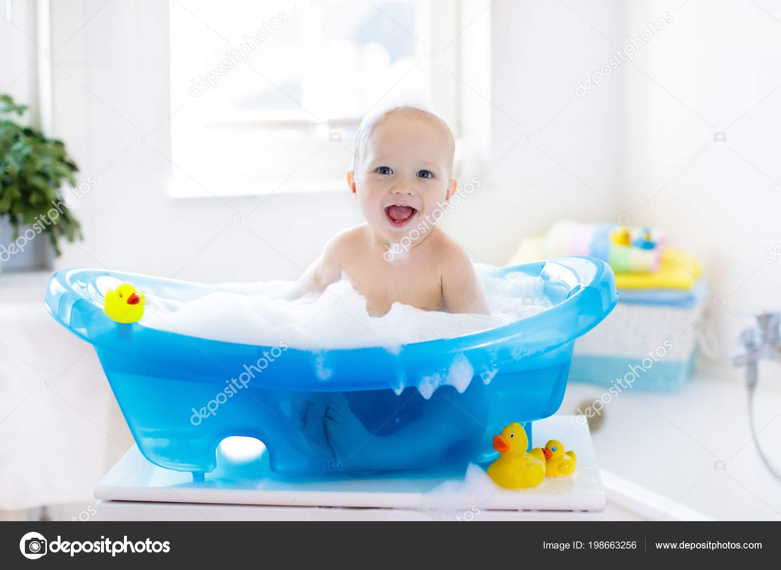 Baby Taking Bath Images / Beautiful Little Girl Taking A Bath At Home A Cute Baby Is Sitting Stock Photo Picture And Royalty Free Image Image 148095230 : Mother bathing her baby and her son watching it.