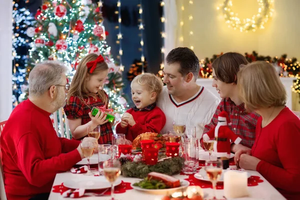 Family Children Eating Christmas Dinner Fireplace Decorated Xmas Tree Parents — Stock Photo, Image