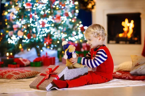 Child Opening Present Christmas Tree Home Kid Xmas Gifts Toys Stock Image